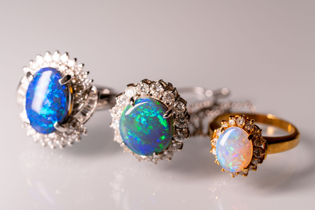 Three rings with opals, two blue opals from Australia and on the right an Ethiopian Welo Opal.