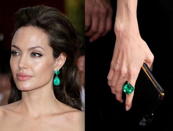 Angelina Jolie at 2009 Academy Awards, wearing iconic emerald earrings and emerald ring by Lorraine Schwartz. The emerald drops featured a total of 115ct in asscher and pear cut emeralds and the ring featured a 65ct square cut emerald.