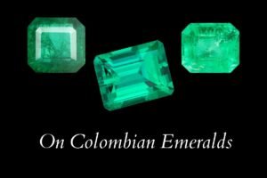 Three colombian emeralds and below the title: On Colombian Emeralds