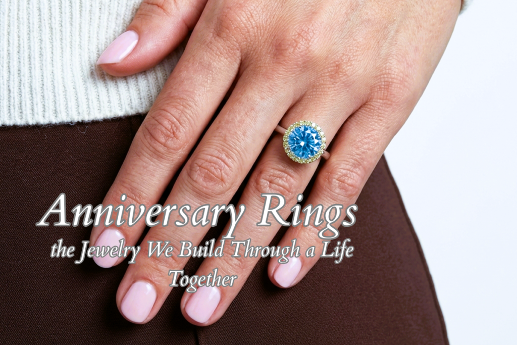 Anniversary Rings and the Jewelry We Build Through a Life Together. In the photograph our Chromatic Aura ring with a central aquamarine and yellow sapphires halo.