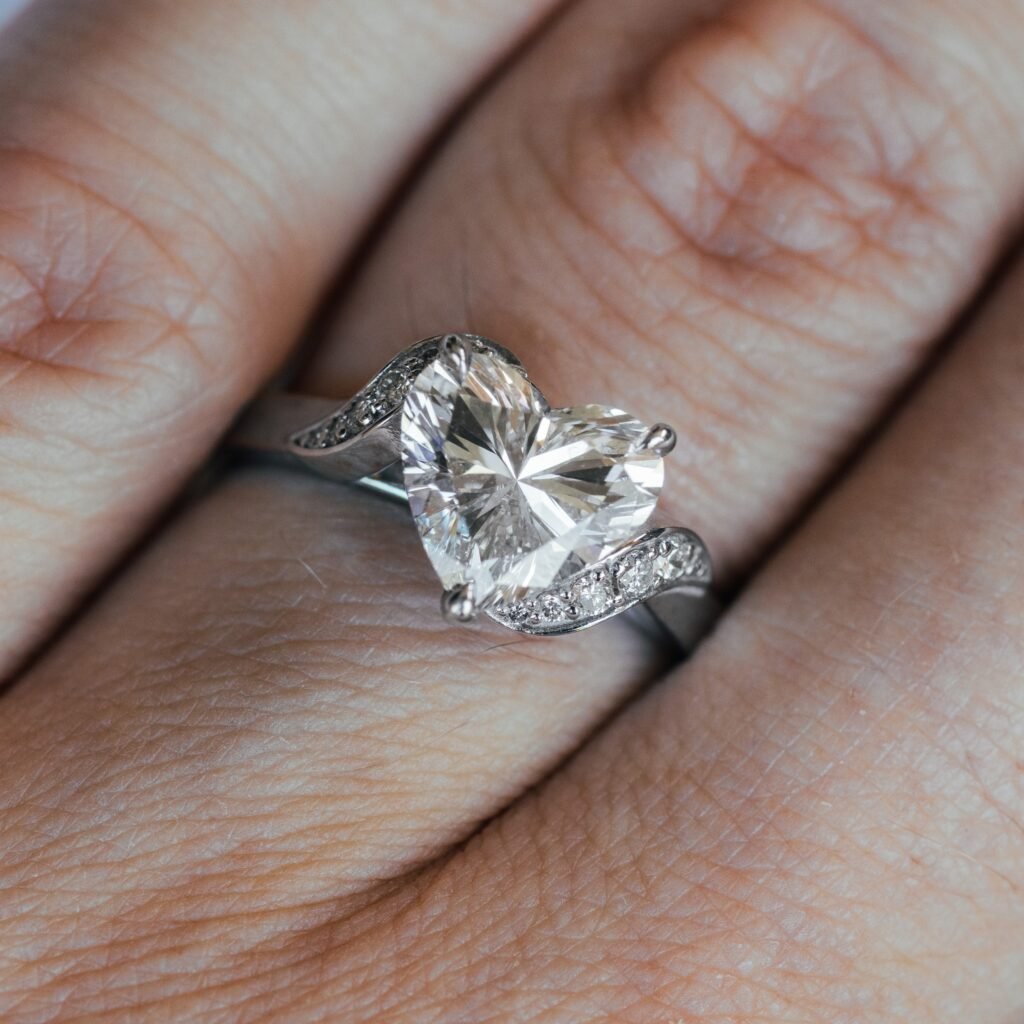 Tina solitaire with heart cut diamond and diamond.